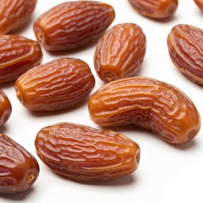 Close-up of Sukkari dates with a rich, caramel-like color, highlighting their soft texture, no text, no words, no typography, 8K