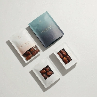 Modern custom packaging for premium dates, featuring elegant design and personalization elements, flat lay, no text, no words, no typography, no labels, clean image