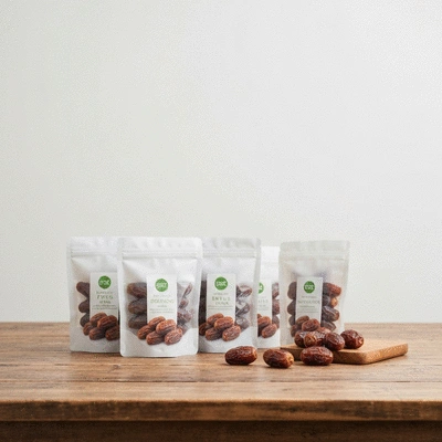 Clean, modern packaging for fresh dates on a wooden table
