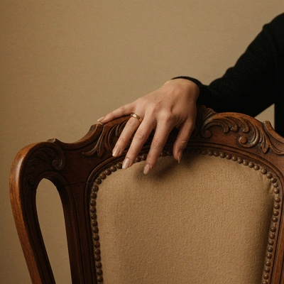 Child's hands reaching for a lunchbox filled with date-based snacks and fruits
