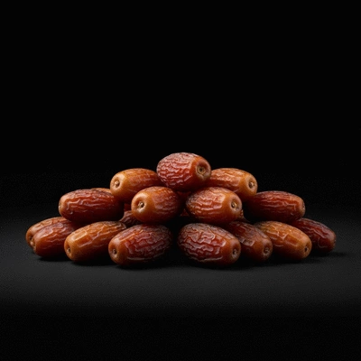 Safawi dates in a clean, elegant product display, showcasing their rich color and texture